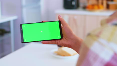 watching a video on phone with green screen