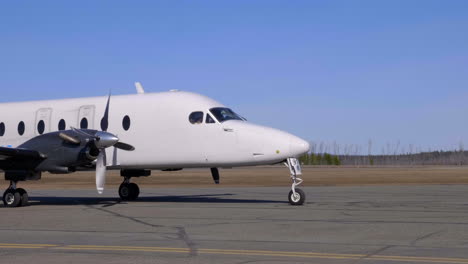 white personal jet getting ready for flight - medium shot