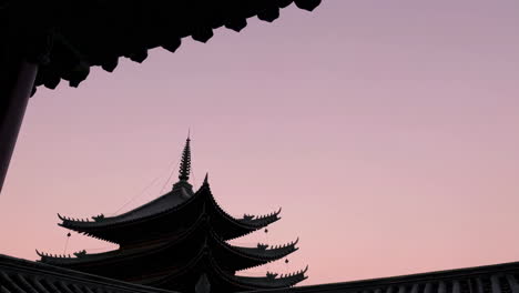 silhouette of a pagoda at sunset