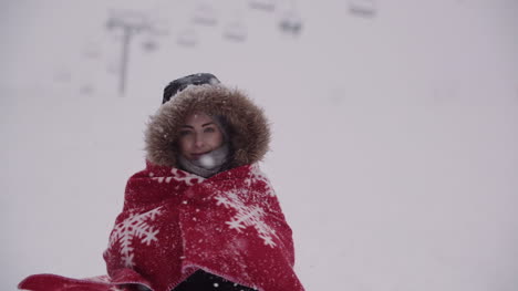 Close-Up-Of-Frozen-Woman-Wrapped-In-A-Blanket-At-Snowstorm