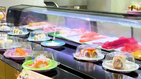 sushi dishes moving on a conveyor belt