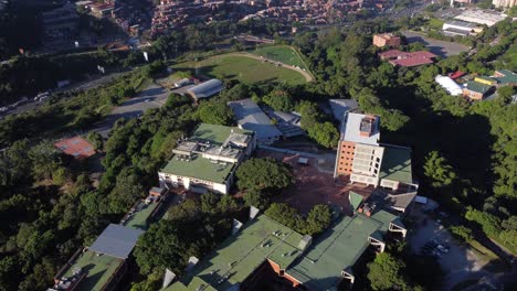 close-up of the universidad metropolitana de caracas (unimet) and in the background the neighborhood of petare, located in venezuela