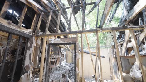 collapsed roof inside of a house that caught fire