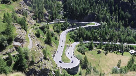 roads the cervinia mountain is a green place in summer, for skiing in winter, with snow at the top. it carries feelings of loneliness, love, hate and awe, above all impression, aesthetic experience