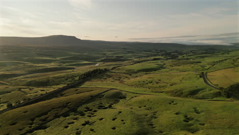 establishing drone shot over north yorkshire fields at golden hour