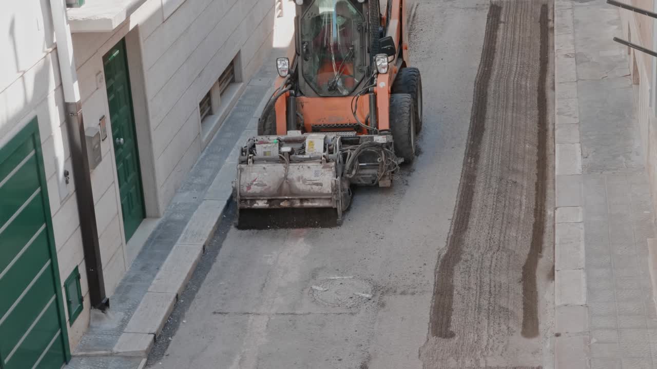 Milling of asphalt for road reconstruction accessory for skid steer