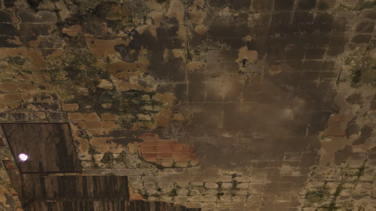 Abandoned and Decaying Brick and Wood Ceiling