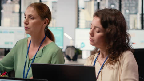 vertical video ambitious woman works at workstation during meeting with colleagues