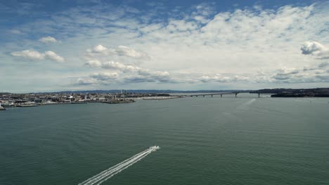 Aerial-view-of-the-Auckland-Harbour-Bridge-and-Auckland-CBD-in-Auckland,-New-Zealand-4k