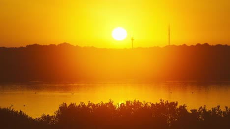 golden yellow sunset above river