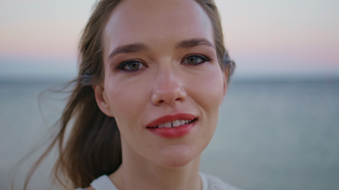 Closeup brunette posing ocean twilight. Portrait serene woman at sunrise horizon