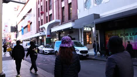 pedestrians walking in melbourne's chinatown