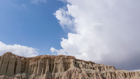 time lapse mountain illuminated by the sun passing through the clouds