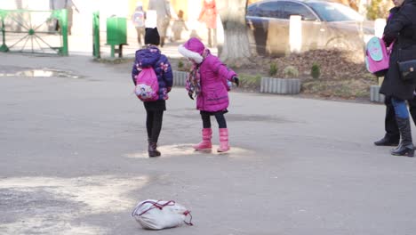 children playing outdoors in winter