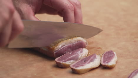 cutting medium rare turkey breast into slices