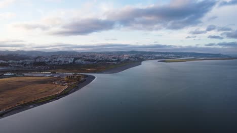 AERIAL-Fly-By-of-Tagus-River-and-its-Little-Inlets-in-Lisbon,-Portugal