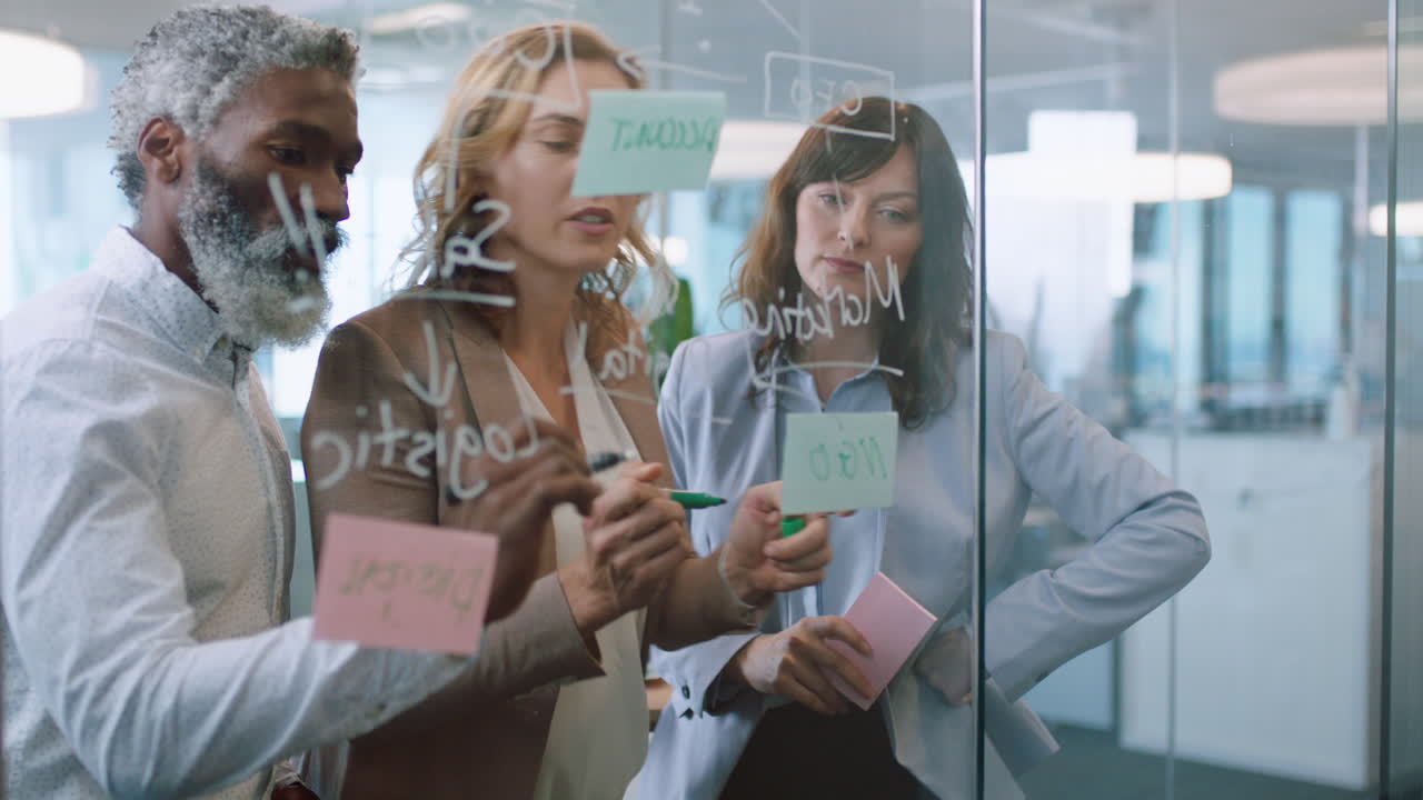 business people using sticky notes mature team leader man brainstorming with colleagues working on solution discussing strategy for project deadline teamwork in office management meeting