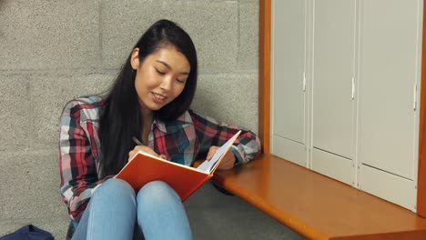 student reading her school book