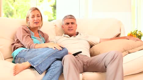 adults watching sports on tv