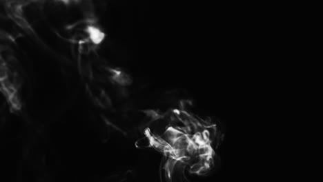 Abstract-black-and-white-smoke-with-a-black-background-in-slow-motion