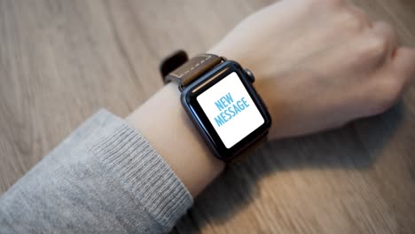 smart watch - incoming message on screen - closeup - slow motion