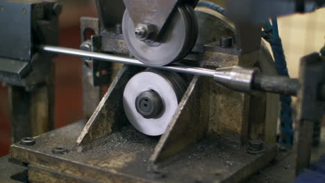 expert male engineer metalworker industrial experienced operator technician worker skilled machinist working intently on large industry in heavy metal factory workshop with large machine