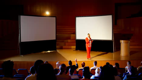 mature caucasian hijab businesswoman speaking in business seminar at auditorium 4k