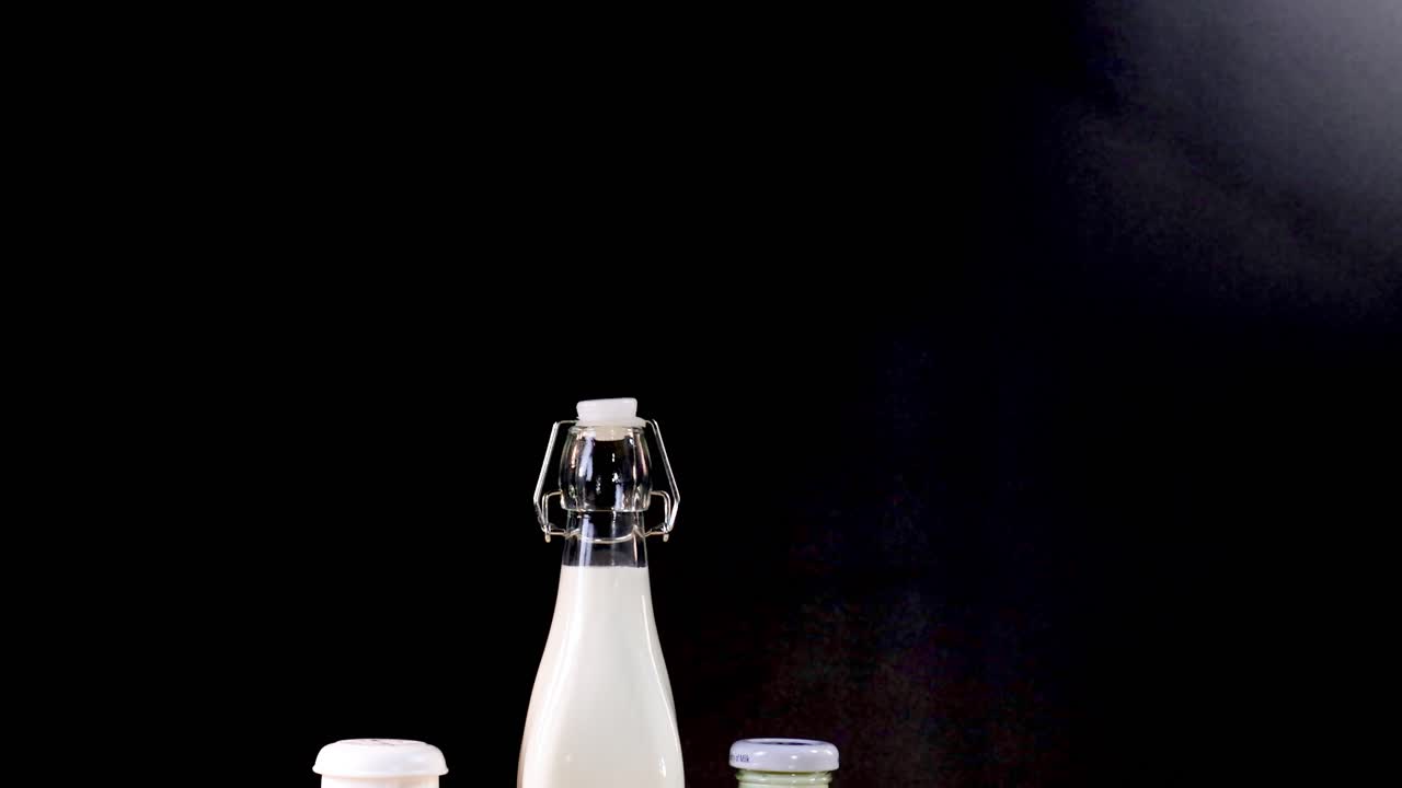 Assorted dairy items displayed against dark backdrop