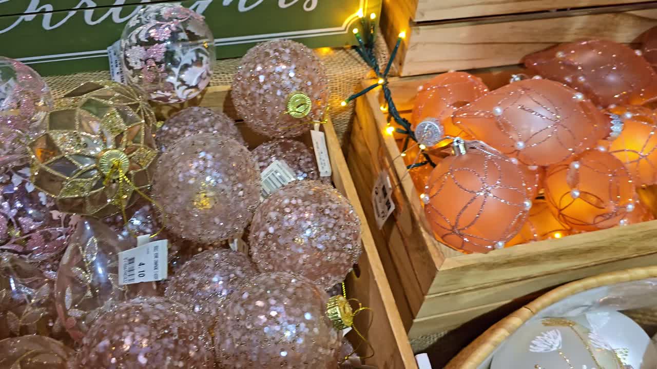 High-angle shot of wooden boxes filled with assorted Christmas baubles
