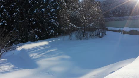 Freshly-Fallen-Snow-over-Rural-Japan-Landscape-in-Yamanouchi,-Nagano