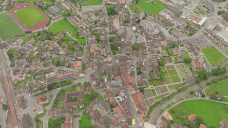 small mountain village with drone shot with cloudy sky