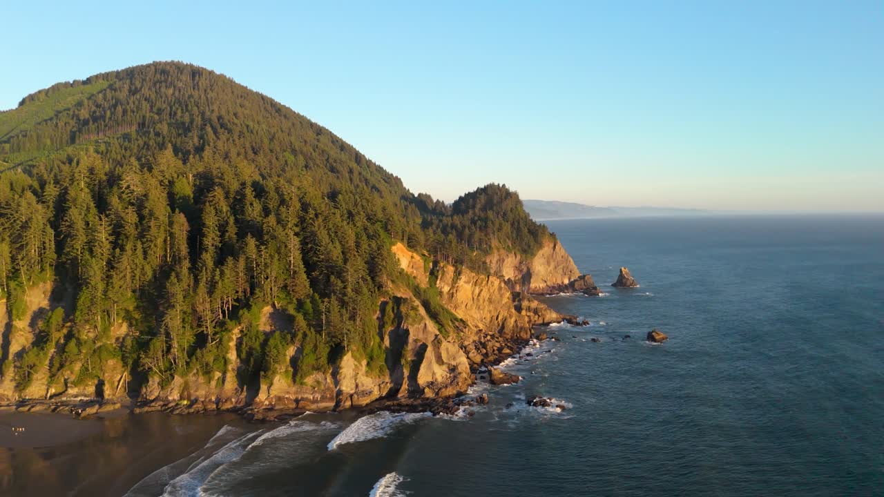 Static drone shot of the Oregon Coast at sunset