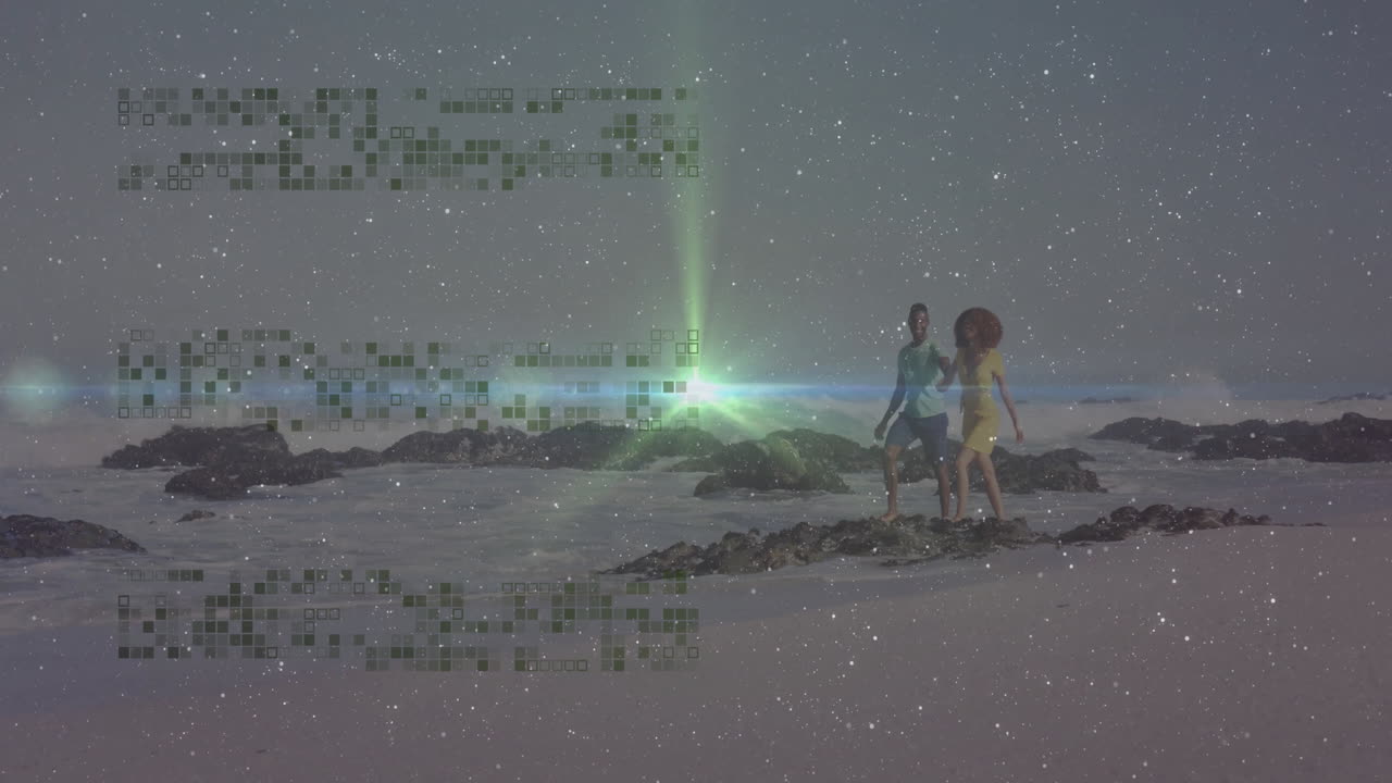 Couple walking on beach with digital data animation over starry sky