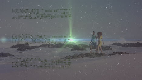 couple walking on beach with digital data animation over starry sky