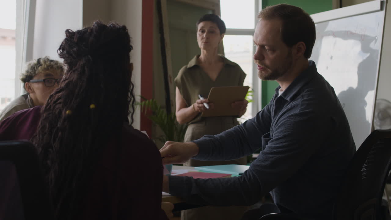 Business professionals in a meeting or training session