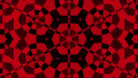 animación de caleidoscopio: formas redondeadas rojas y negras, con un ligero destello de la lente