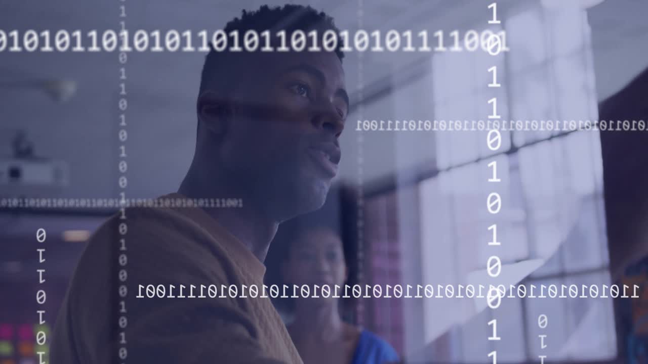 Animation of binary coding over diverse colleagues discussing work in office