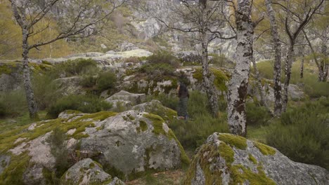 woman traveler walking in covao d ametade in serra da estrela, portugal