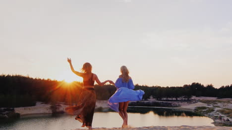 two young women in a light airy dresses run toward the sun concept freedom women's dreams health you