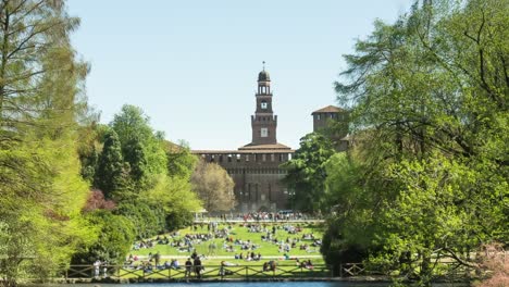 palazzo del arte and tourists in historical center of milan