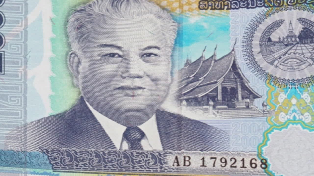 Lao Kip Banknotes Featuring Portrait of Kaysone Phomvihane and Landmarks