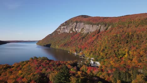 Beautiful-aerial-drone-footage-of-the-fall-leaves-on-and-around-Mount-Hor,-Mount-Pisgah,-and-Lake-Willoughby-during-peak-autumn-foliage-at-Willoughby-State-forest-in-Westmore,-Vermont