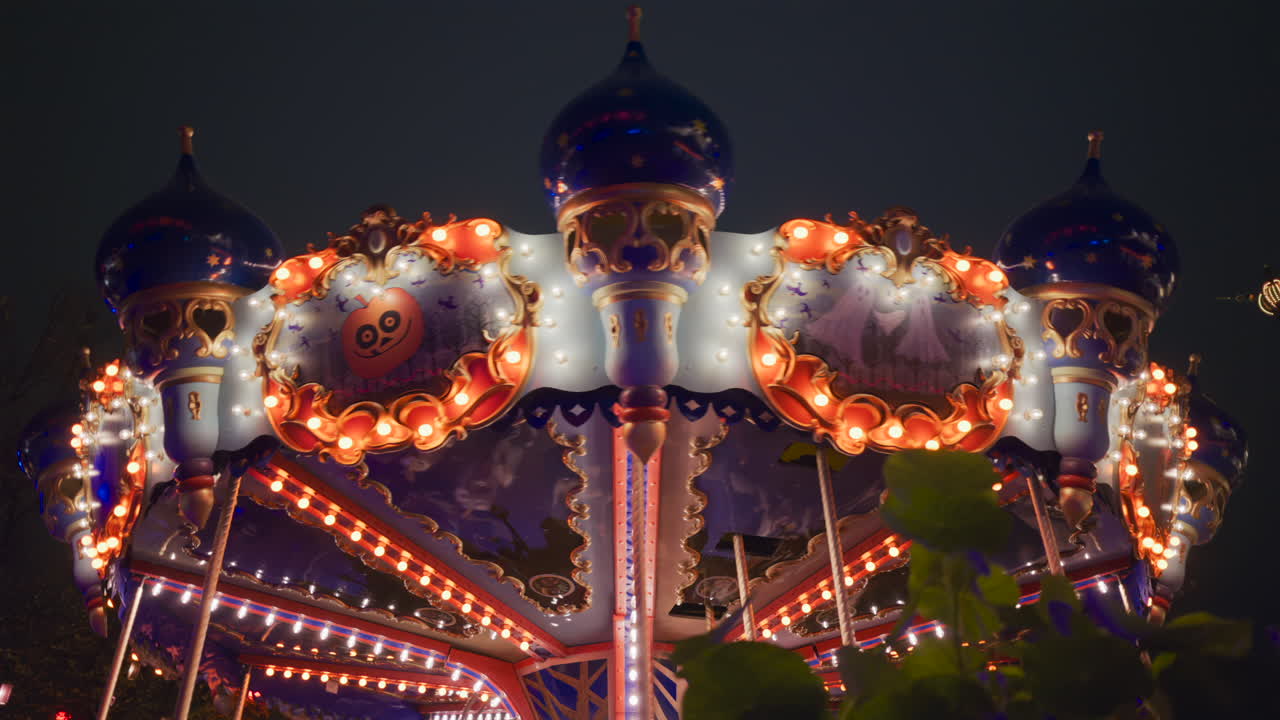 Halloween decorated carousel at the Tivoli Gardens amusement park in Copenhagen, Denmark at night
