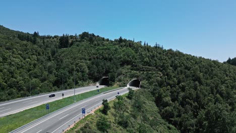 aerial drone fly above green mountain highway at arbucies girona, european warm summer trip in catalonia, spain