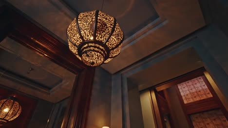 ornate moroccan lantern hanging in elegant interior