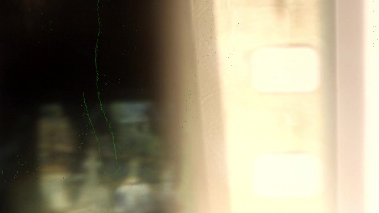 Close Up of Moving Vintage Film Strip with Light Leaks and Scratches