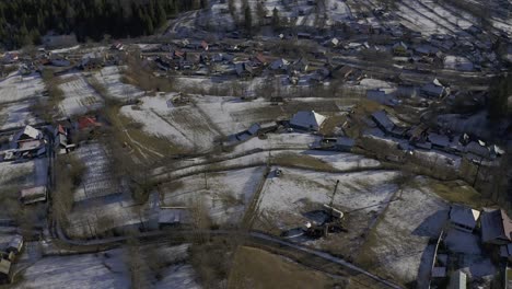 Drone-view-of-village-at-the-bottom-of-a-hillside