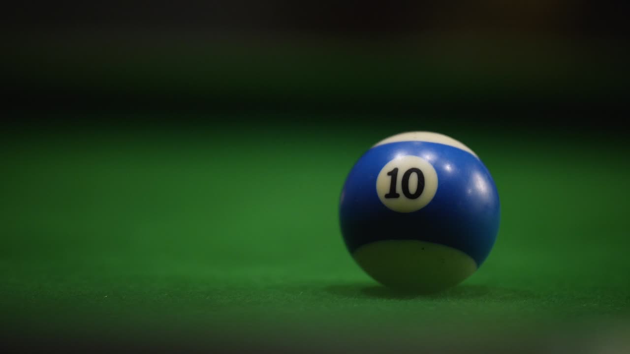 Group of friends playing at the pool table, Goa, India.