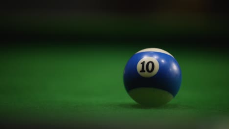 group of friends playing at the pool table, goa, india.