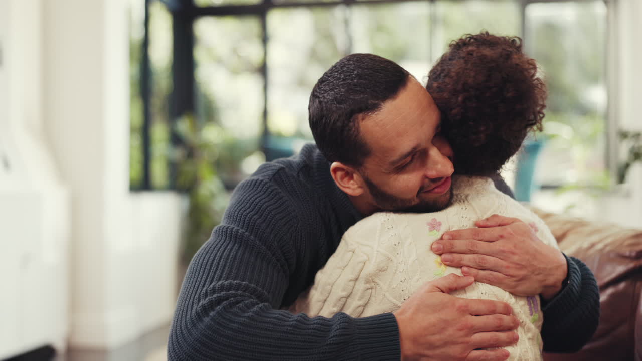 A father and daughter share a heartwarming hug